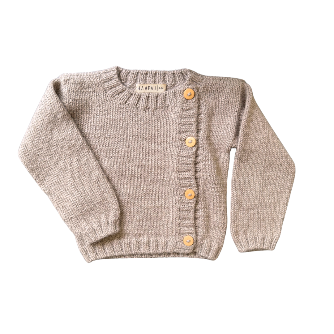 Luxury baby alpaca sweater from Our Green House, perfect for a cozy first Christmas.