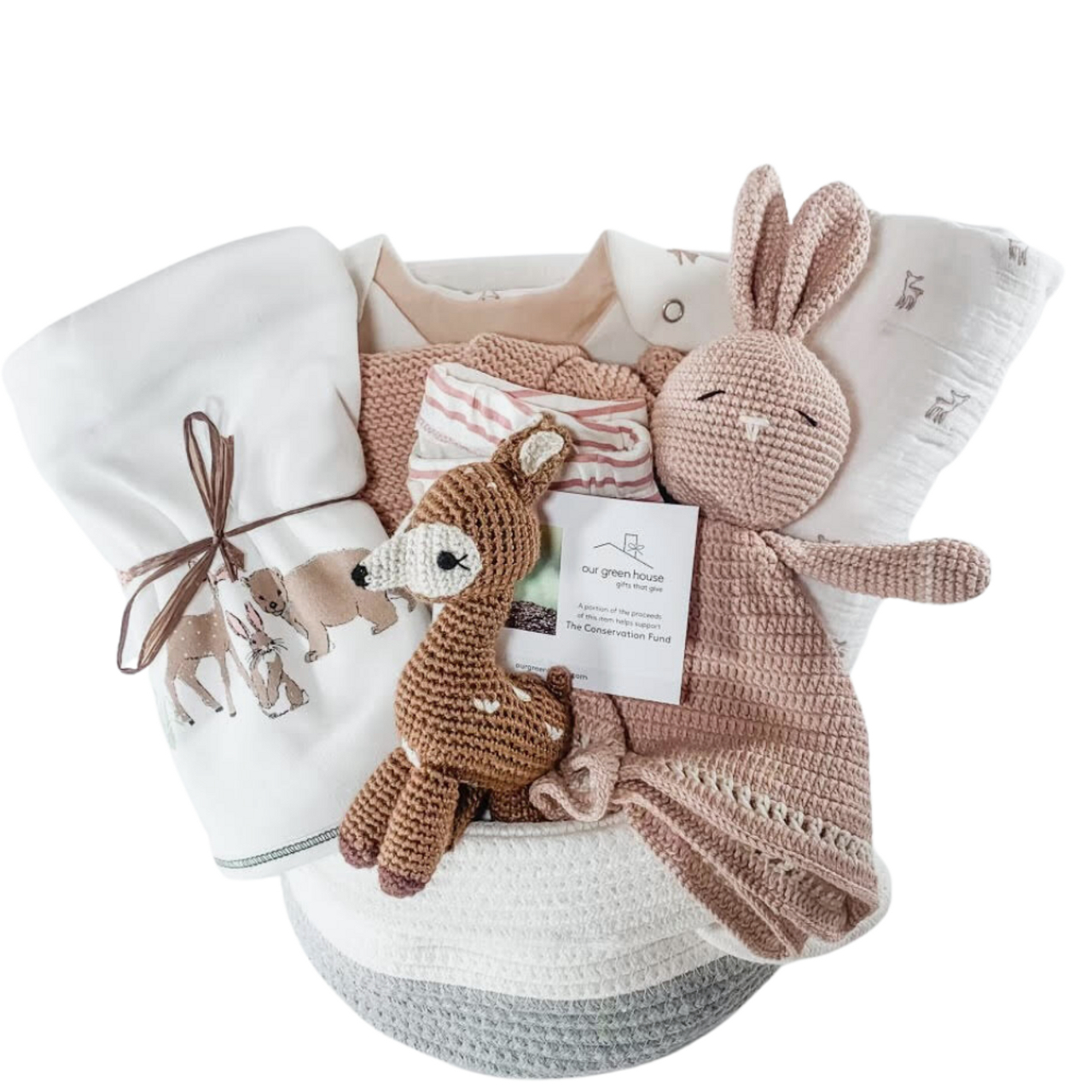 Our Green House baby basket with moose-themed clothes, knit toy, and wooden teether in a two-tone rope basket.