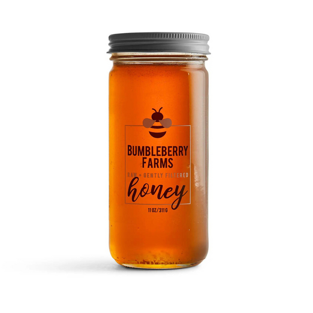 Bumbleberry honey jar from Our Green House, a delicious and eco-friendly addition to any housewarming gift basket.