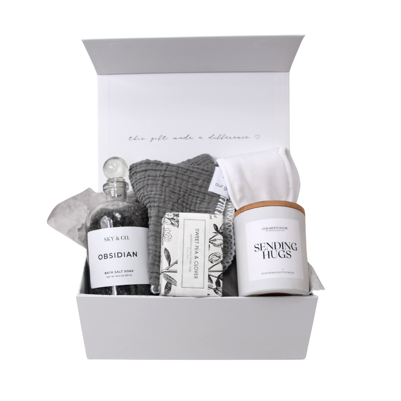 Our Green House gift box with bath salts, soap, soft cloths, and a “Sending Hugs” candle for comfort and relaxation.