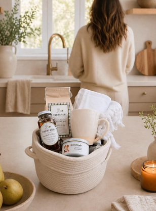 Cozy kitchen gift basket with coffee, honey jar, candle, mug, and linen towel from Our Green House.