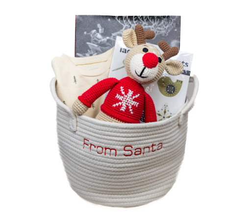 Children&rsquo;s holiday gift basket from Our Green House filled with toys, crafts, and cozy items.
